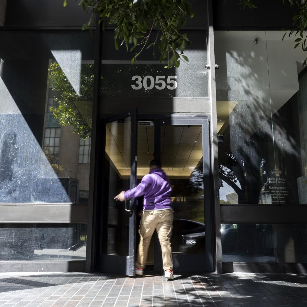 A person enters the building on Wilshire Boulevard where the TransLatin@ Coalition has its offices.