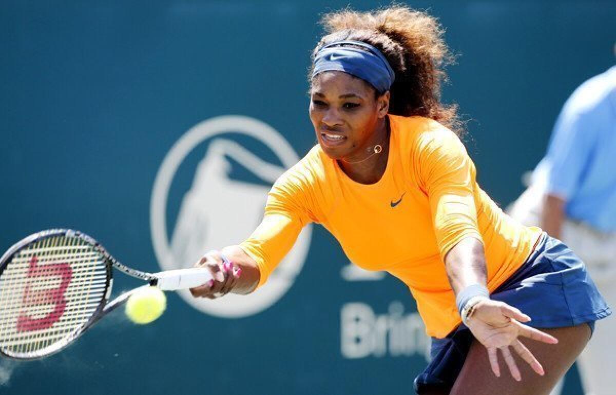 Serena Williams tracks down a forehand return against Jelena Jankovic in the championship match of the Family Circle Cup.