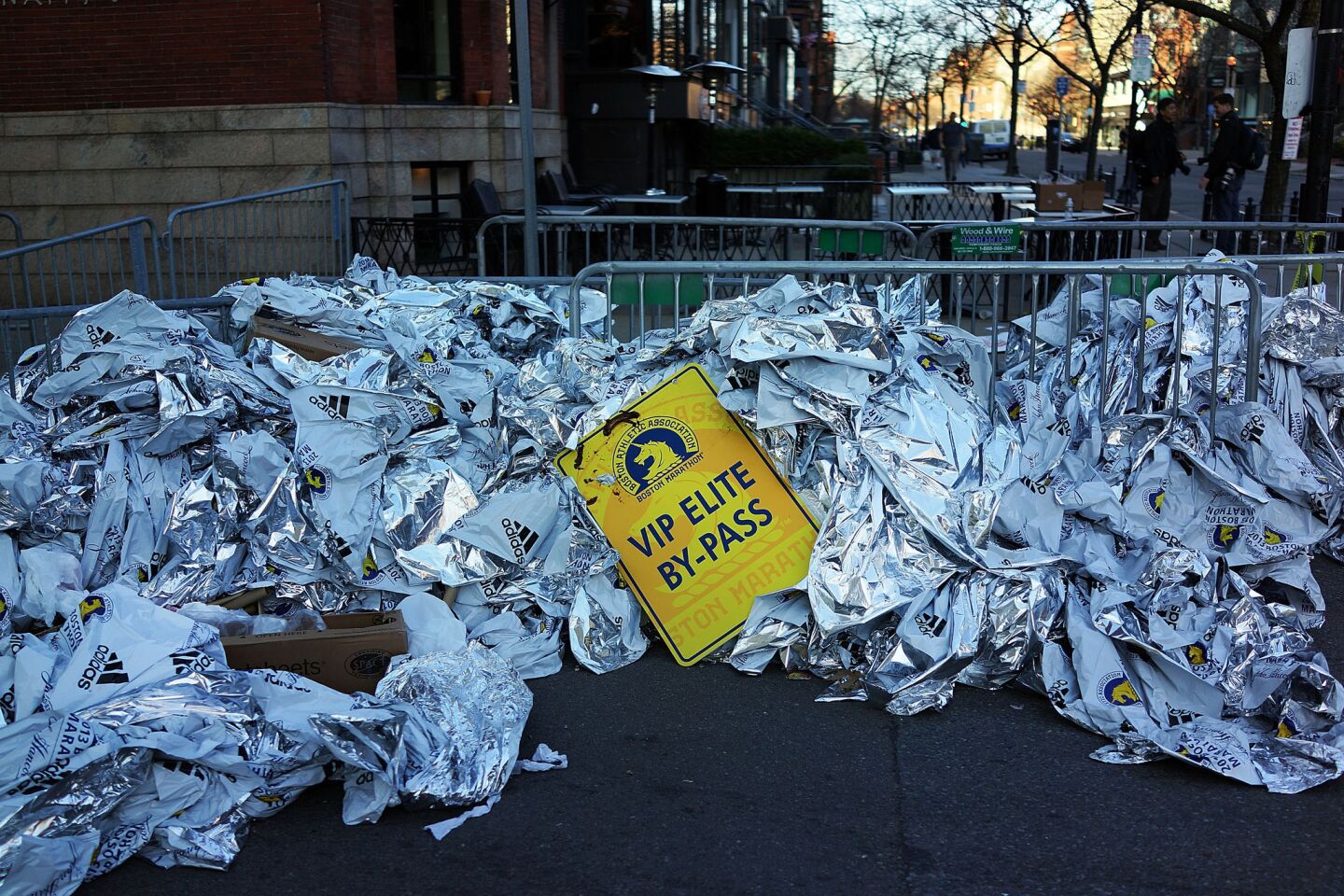 Unused thermal blankets meant for marathon participants are piled near the scene of a twin bombings at the Boston Marathon.