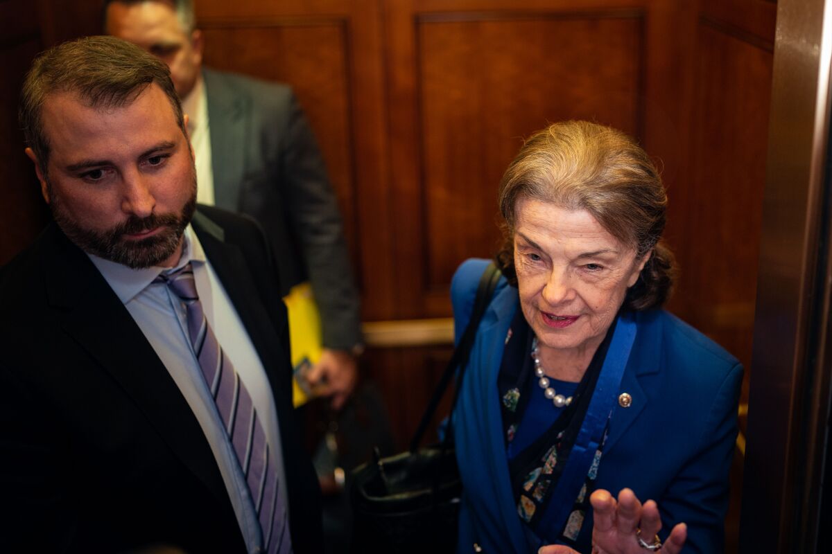 California Sen. Dianne Feinstein speaks to reporters after departing the Senate chamber