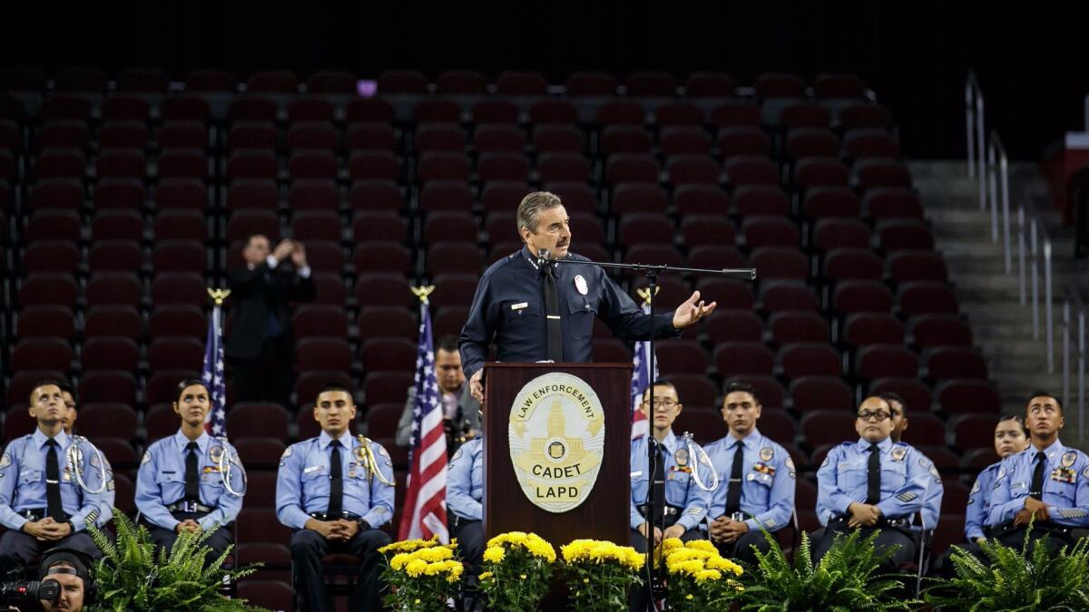 LAPD Chief Charlie Beck addresses the department's cadets at a graduation ceremony last month. “Our goal is to make you the best human beings you can possibly be," he told them.