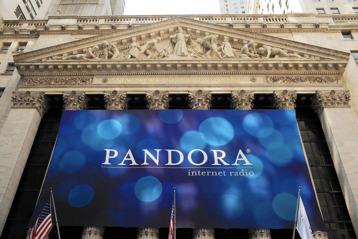 Pandora needs songs for its music streaming service and has a strong incentive to lower the royalty rates it pays to performers and songwriters alike. Above, a Pandora banner hangs in front of the New York Stock Exchange on the company's first day of trading as a public company in 2011.