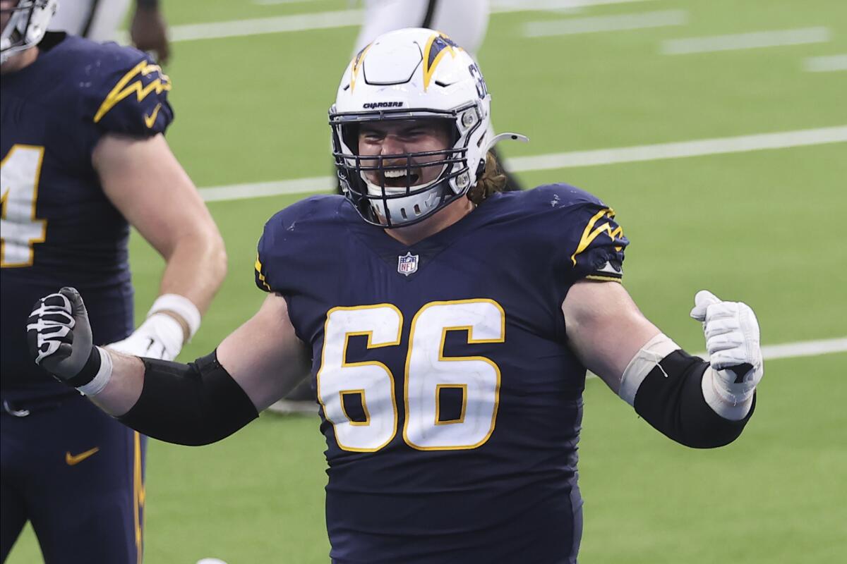 Chargers center Dan Feeney makes two fists.