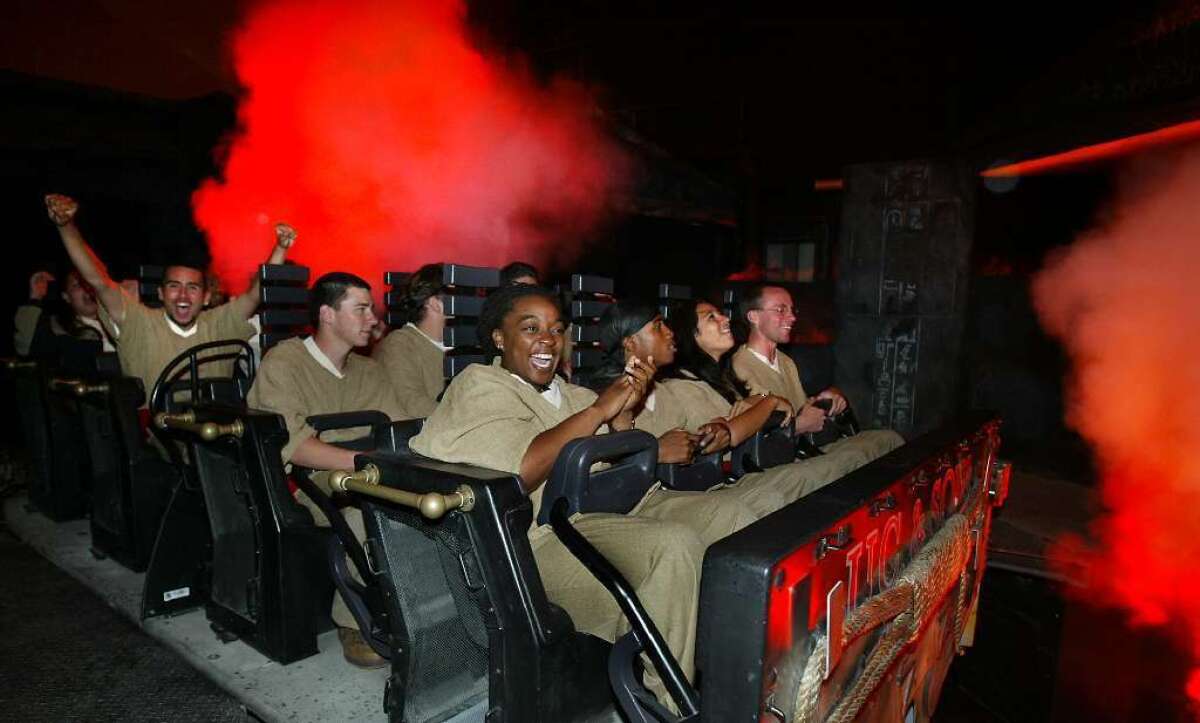 Visitors to Universal Studios Hollywood can take a spin on the Revenge of the Mummy ride amid the rain.