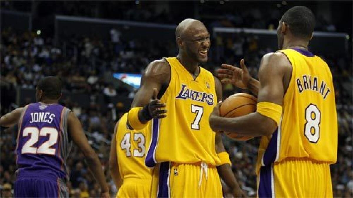 Lakers Lamar Odom and Kobe Bryant celebrate a win over the Suns in Game 3 of the NBA Playoffs at Staples Center.