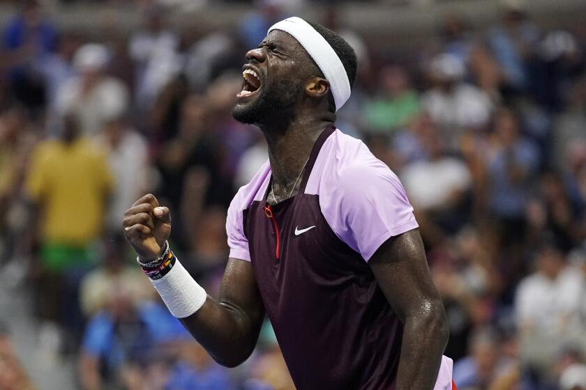 Frances Tiafoe, of the United States, celebrates after winning a point against Rafael Nadal.
