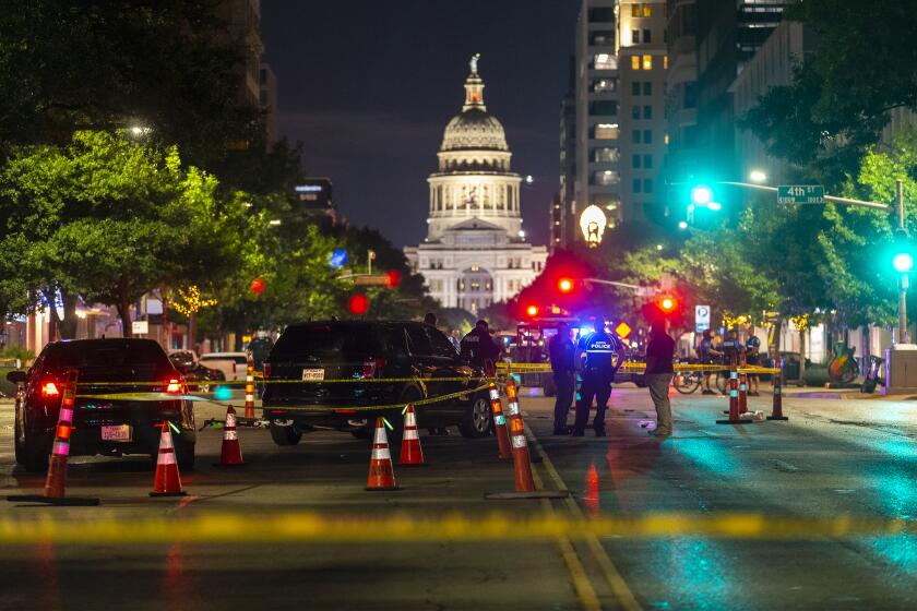 Austin police investigate a homicide shooting which occurred at a demonstration against police violence in downtown Austin, Saturday, July 25, 2020. (Stephen Spillman/Austin American-Statesman via AP)