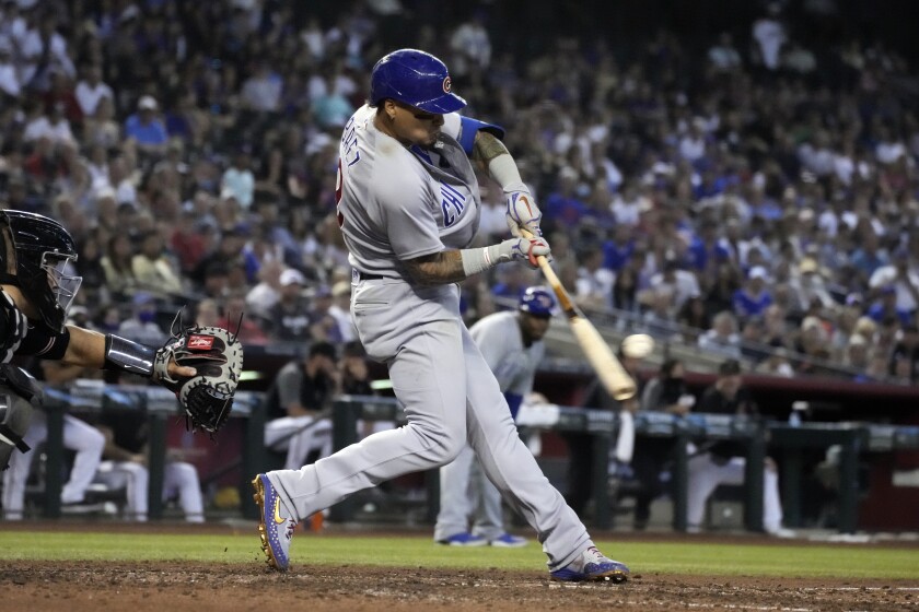 Chicago Cubs' Javier Baez hits an RBI-double against the Arizona Diamondbacks in the sixth inning during a baseball game, Saturday, July 17, 2021, in Phoenix. (AP Photo/Rick Scuteri)