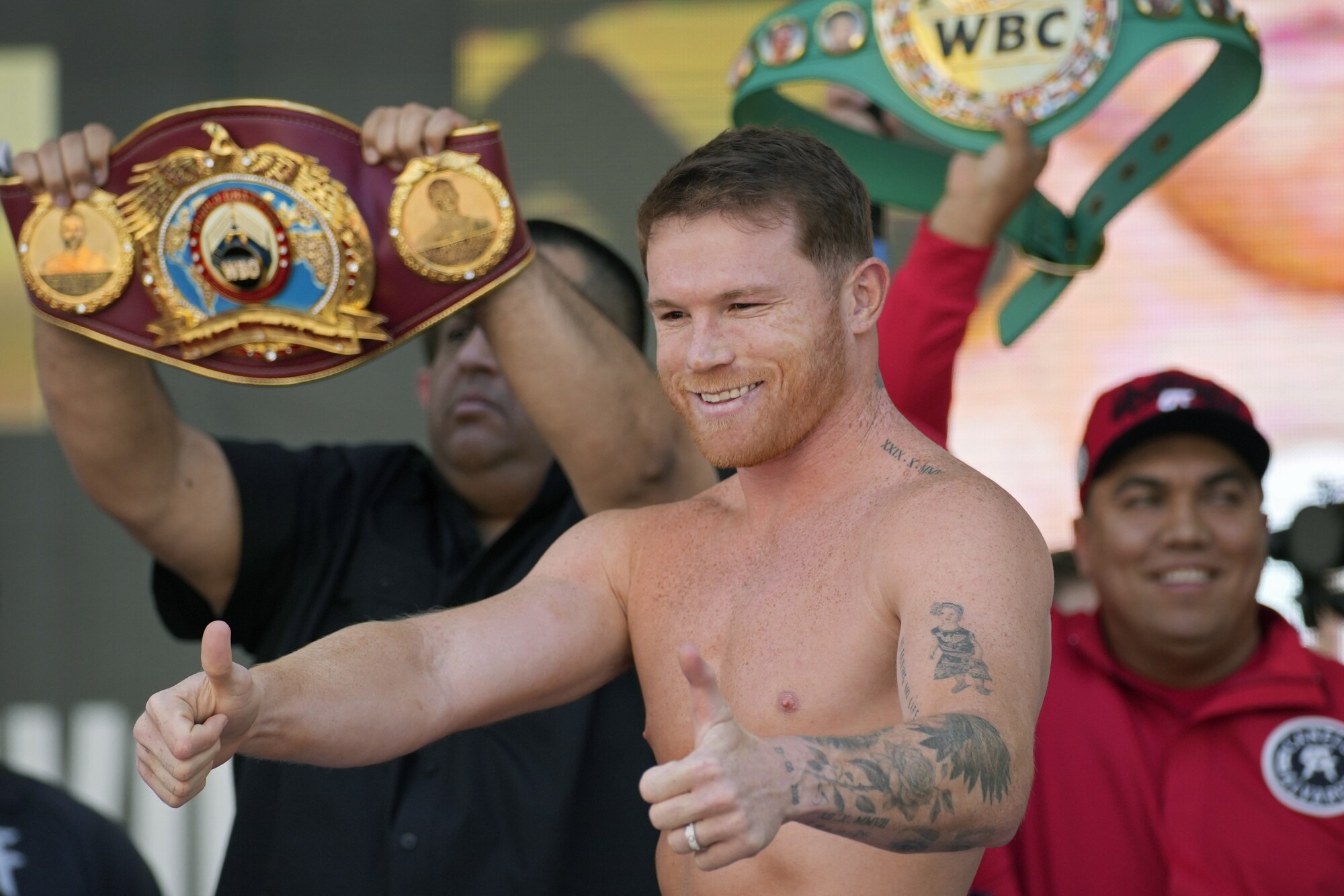 Canelo Álvarez motions to the crowd during a ceremonial boxing weigh-in Friday