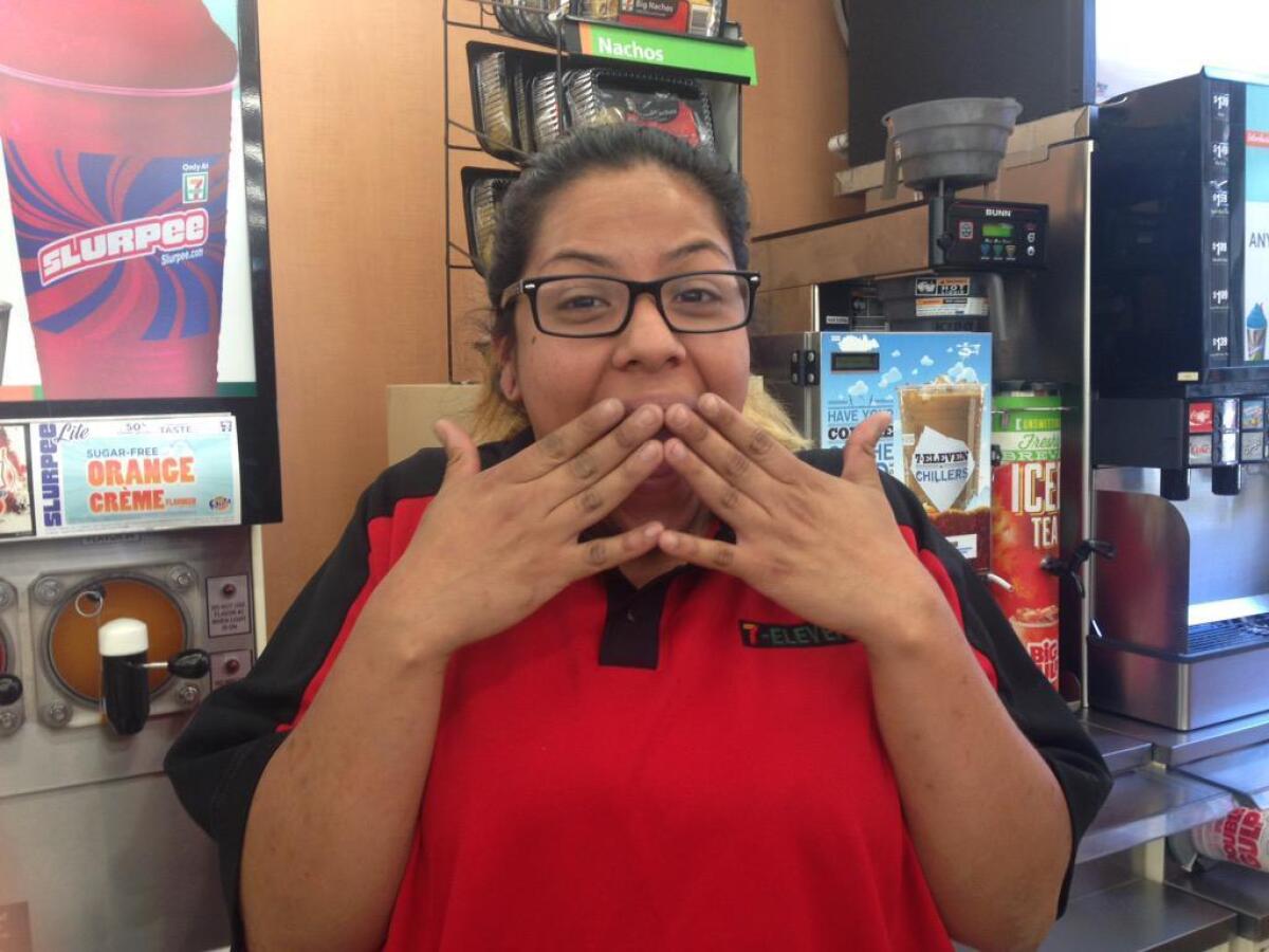 Gabriela Chavez at a 7-Eleven in downtown Los Angeles reacts to the news than a man lost his Powerball ticket worth $1 million.
