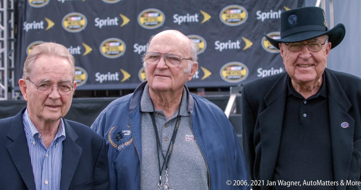 Shav Glick stands between racing legends Phil Hill, left, and Carroll Shelby at California Speedway in 2006.