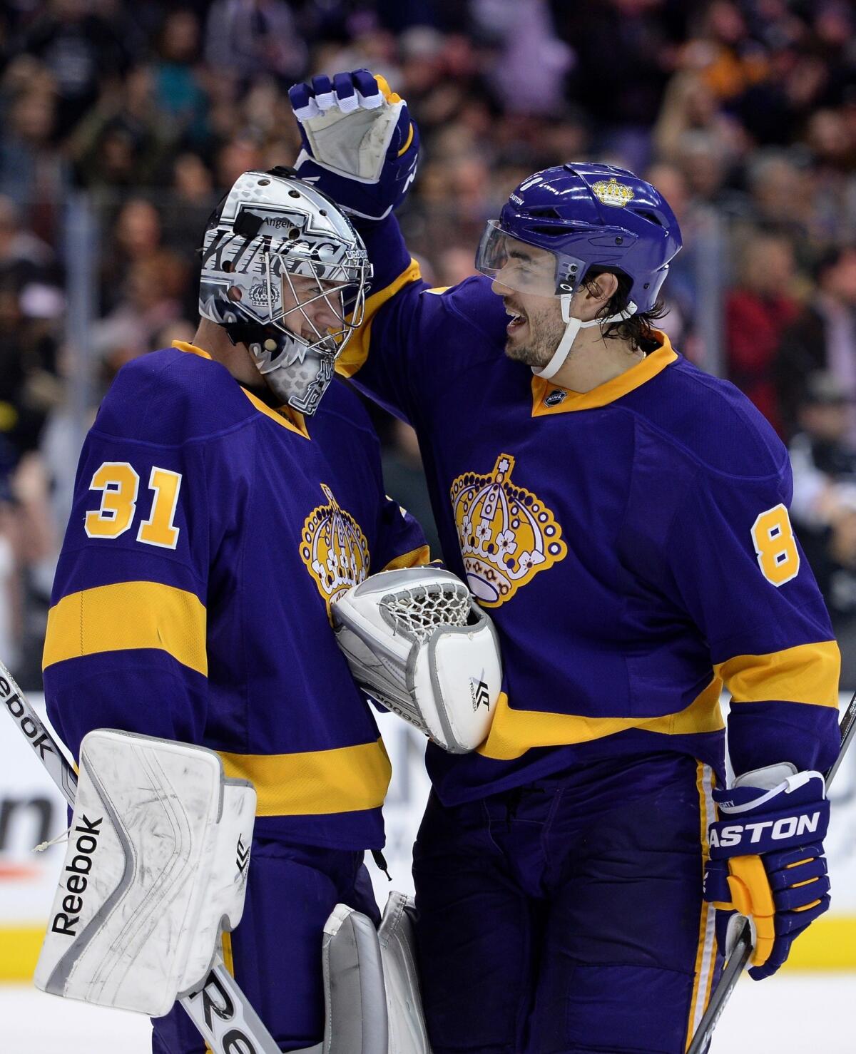 Kings goalie Martin Jones is congratulated by teammate Drew Doughty following the Kings' 3-0 victory Saturday over the New York Islanders.