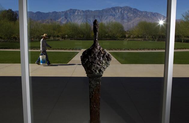 "Bust of Diego on Stele III," a 1958 bronze by Alberto Giocometti, with the San Jacinto Mountains rising in the distance.