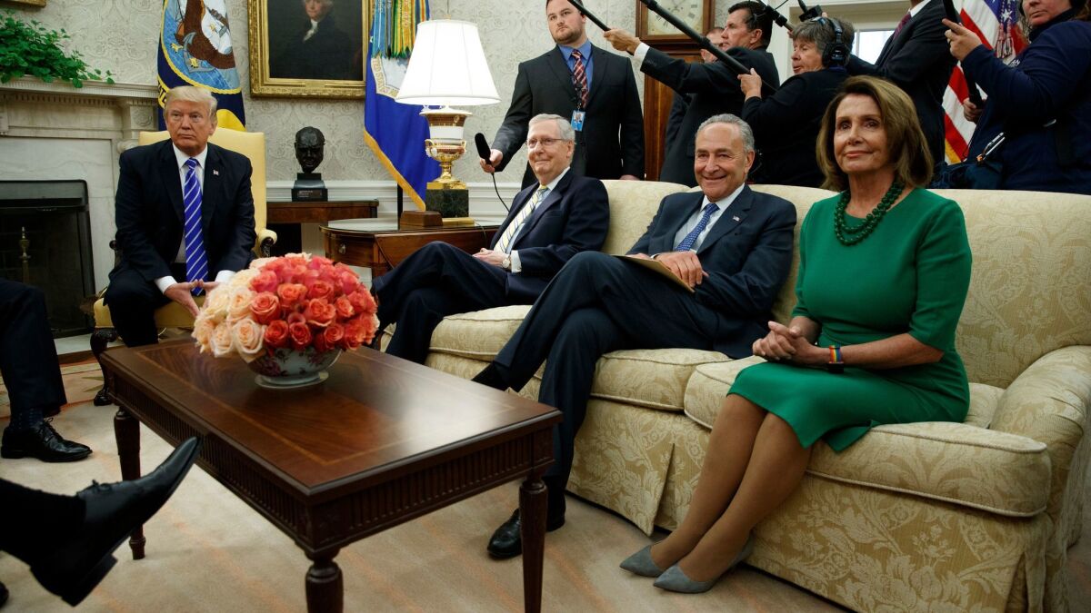 President Trump meets with, from left, Senate Majority Leader Mitch McConnell, Senate Minority Leader Charles Schumer and House Minority Leader Nancy Pelosi, along with other congressional leaders, at the White House in September.