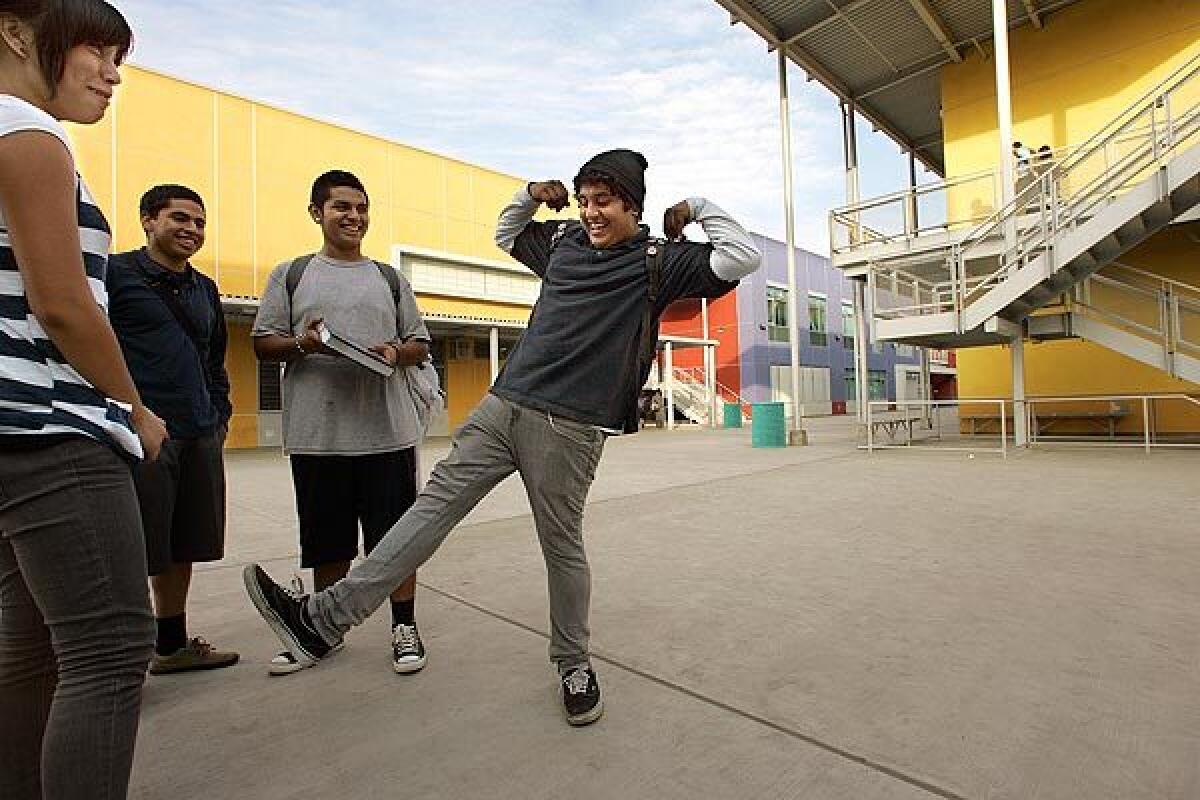 Victor Avila, 17, shows off his moves to peers at Felicitas and Gonzalo Mendez Learning Center. Most of the students were transferred to the new campus from Roosevelt High.