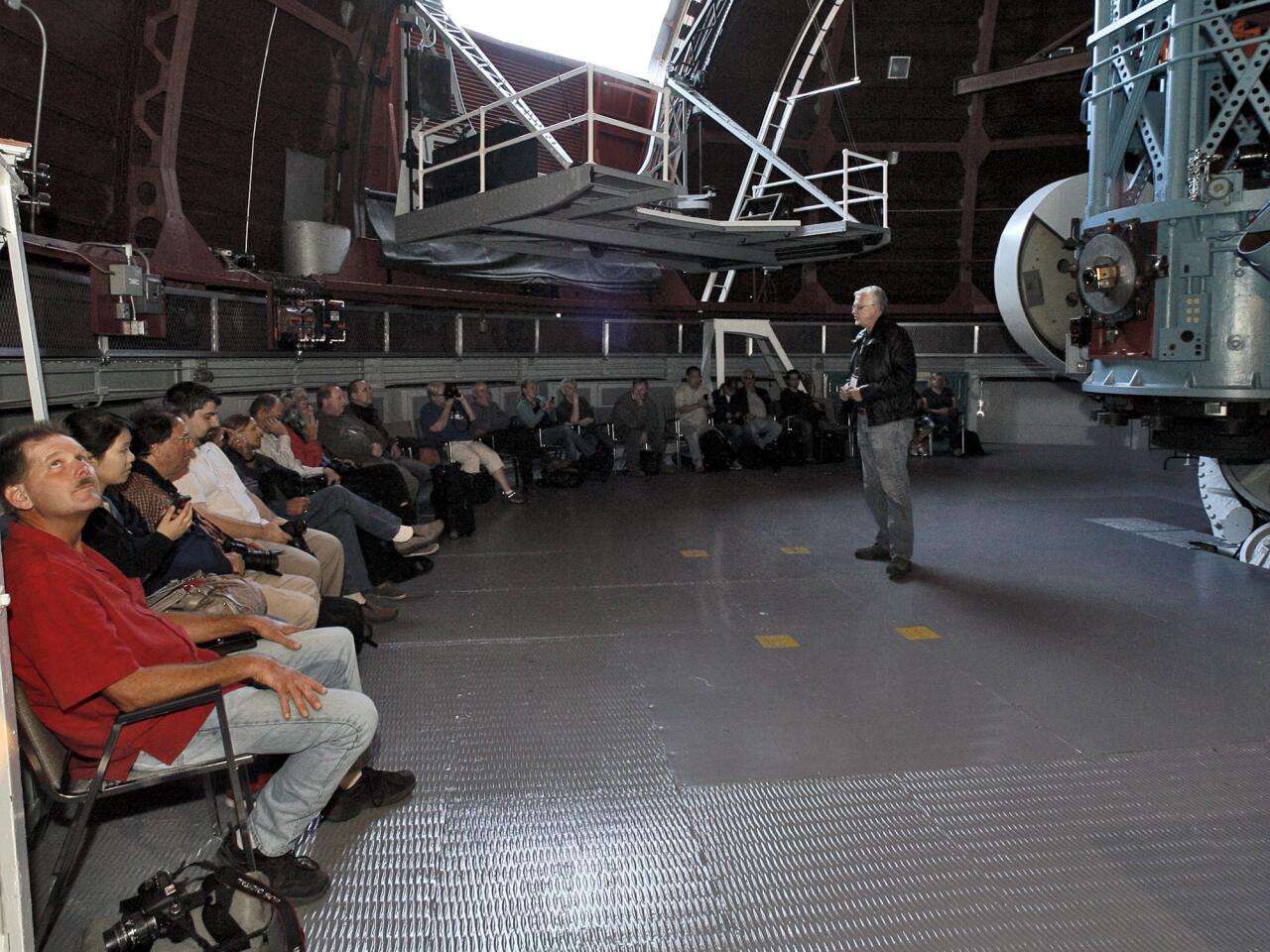 Astronomy buffs listen to Mt. Wilson Observatory Superintendent David Jurasevich talk about the 60-inch telescope at right during an astrophotography workshop at the historic facilities on Sunday, Oct. 14, 2012. The class, first of its type and sponsored by Canon USA and Samy's Camera, brought 25 astrophotography enthusiasts to the observatory high above the city of Pasadena for a night of star photography. The students were able to take some photos through the 60-inch telescope.