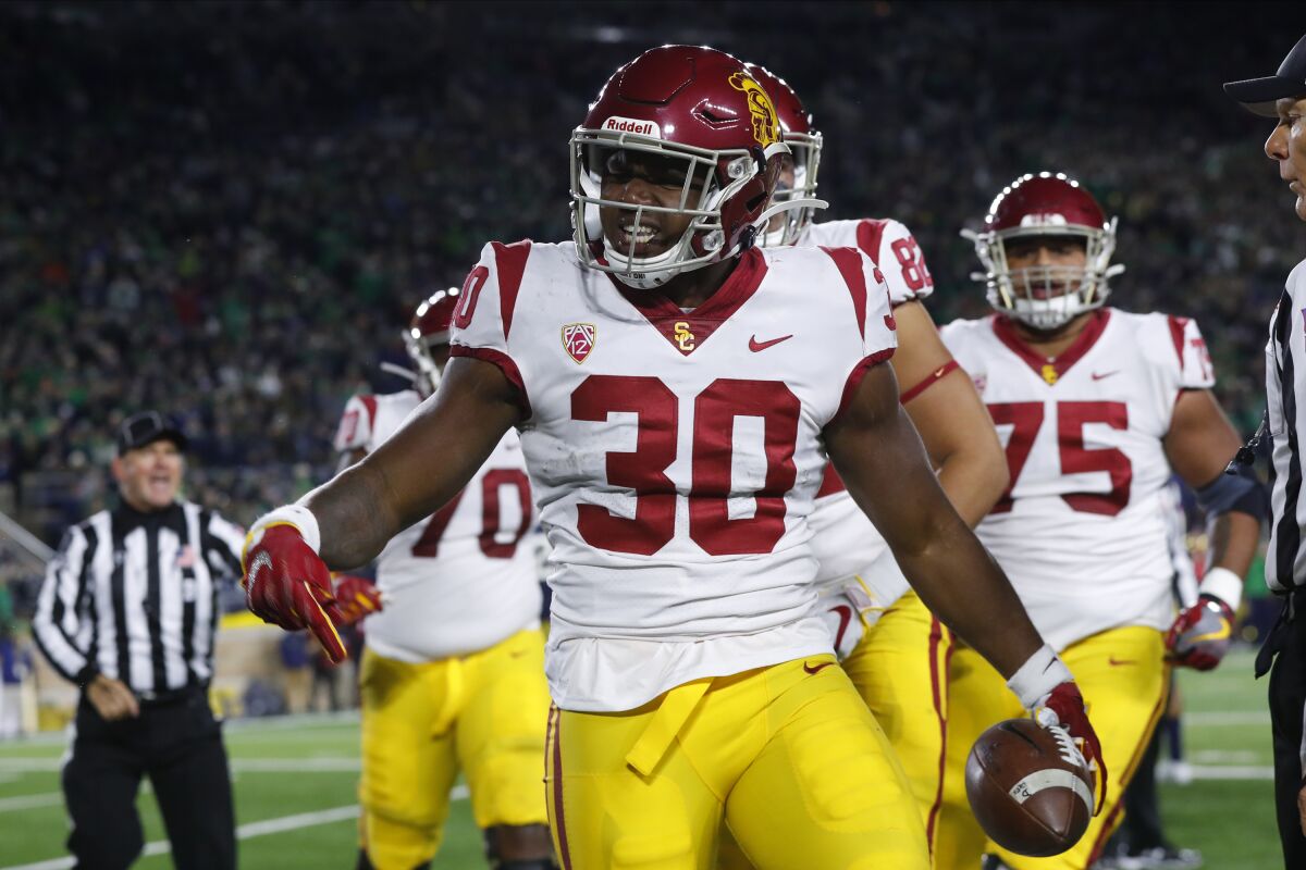 USC running back Markese Stepp celebrates after scoring on a two-yard touchdown run.