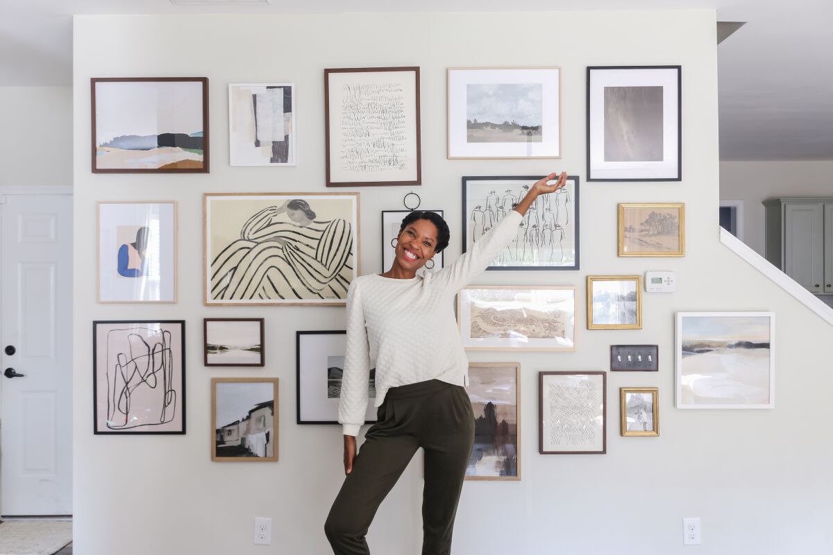 Tiffany DeLangie shows off one of her gallery walls.