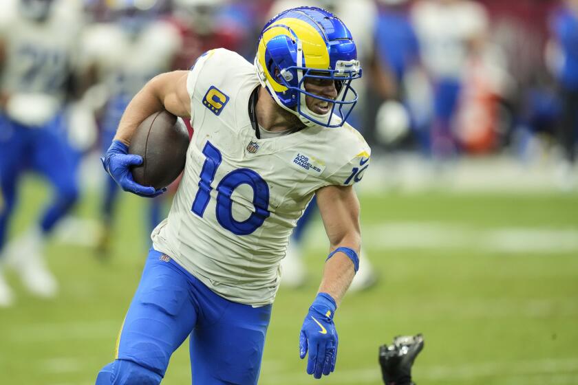 Rams wide receiver Cooper Kupp runs after making a catch against the Arizona Cardinals on Sunday.