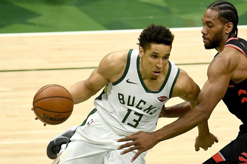 MILWAUKEE, WISCONSIN - MAY 15: Malcolm Brogdon #13 of the Milwaukee Bucks dribbles the ball while being guarded by Kawhi Leonard #2 of the Toronto Raptors in the second quarter in Game One of the Eastern Conference Finals of the 2019 NBA Playoffs at the Fiserv Forum on May 15, 2019 in Milwaukee, Wisconsin. NOTE TO USER: User expressly acknowledges and agrees that, by downloading and or using this photograph, User is consenting to the terms and conditions of the Getty Images License Agreement. (Photo by Stacy Revere/Getty Images) ** OUTS - ELSENT, FPG, CM - OUTS * NM, PH, VA if sourced by CT, LA or MoD **