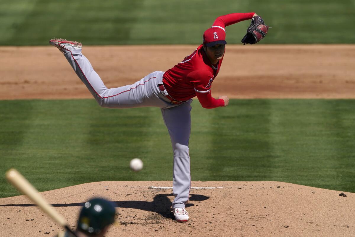 Shohei Ohtani delivers a pitch.