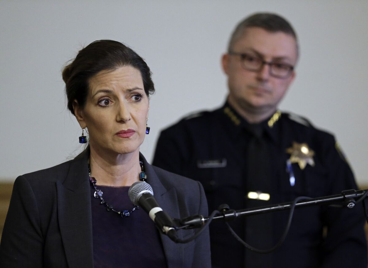 Oakland Mayor Libby Schaaf, left, speaks beside Oakland Chief of Police Sean Whent in May. He resigned amid a department sex-crimes scandal this summer.