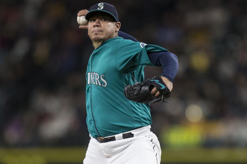 Seattle Mariners pitcher Felix Hernandez delivers a pitch during the sixth inning against the Minnesota Twins on Friday.