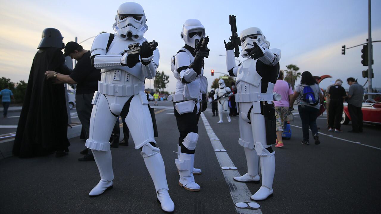 Members of the 501st Legion and the Orange County Star Wars Society prepare to march in Stormtrooper costumes during the Anaheim Halloween Parade on Oct. 24. A group of cosplayers/fans dressed as their favorite "Star Wars" character march in the Anaheim Halloween Parade. ------------ For the Record: Oct. 30, 7:30 p.m. Slides 11 through 13 of this photo gallery incorrectly refer to the 501st Legion as the 501st Rebel Legion. ------------
