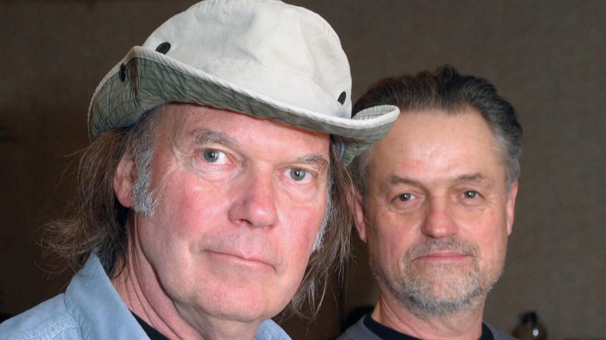 Musician Neil Young, left, and director Jonathan Demme at the South by Southwest music festival in 2006 in Texas.