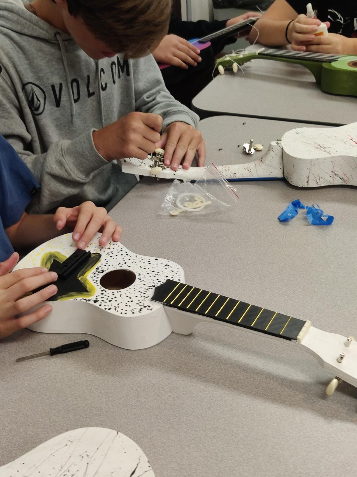 Dwyer Middle School students made ukuleles as part of the "Just Keep Strumming" school art project.