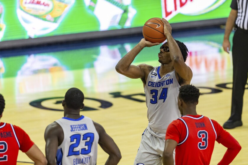 Creighton guard Denzel Mahoney (34) makes a free throw against St. John's in the second half during an NCAA college basketball game Saturday, Jan. 9, 2021, in Omaha, Neb. (AP Photo/John Peterson)