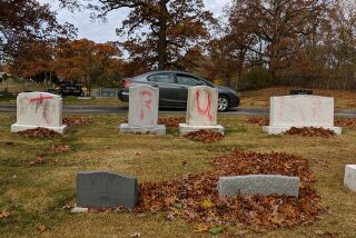 This photo provided by the Anti- Defamation League Michigan shows headstones at a Jewish cemetery in Grand Rapids, Mich., spray-painted with "TRUMP" and "MAGA" before President Donald Trump held his final campaign rally in the western Michigan city, Monday, Nov. 2, 2020. (Ed Miller/Anti- Defamation League Michigan via AP)