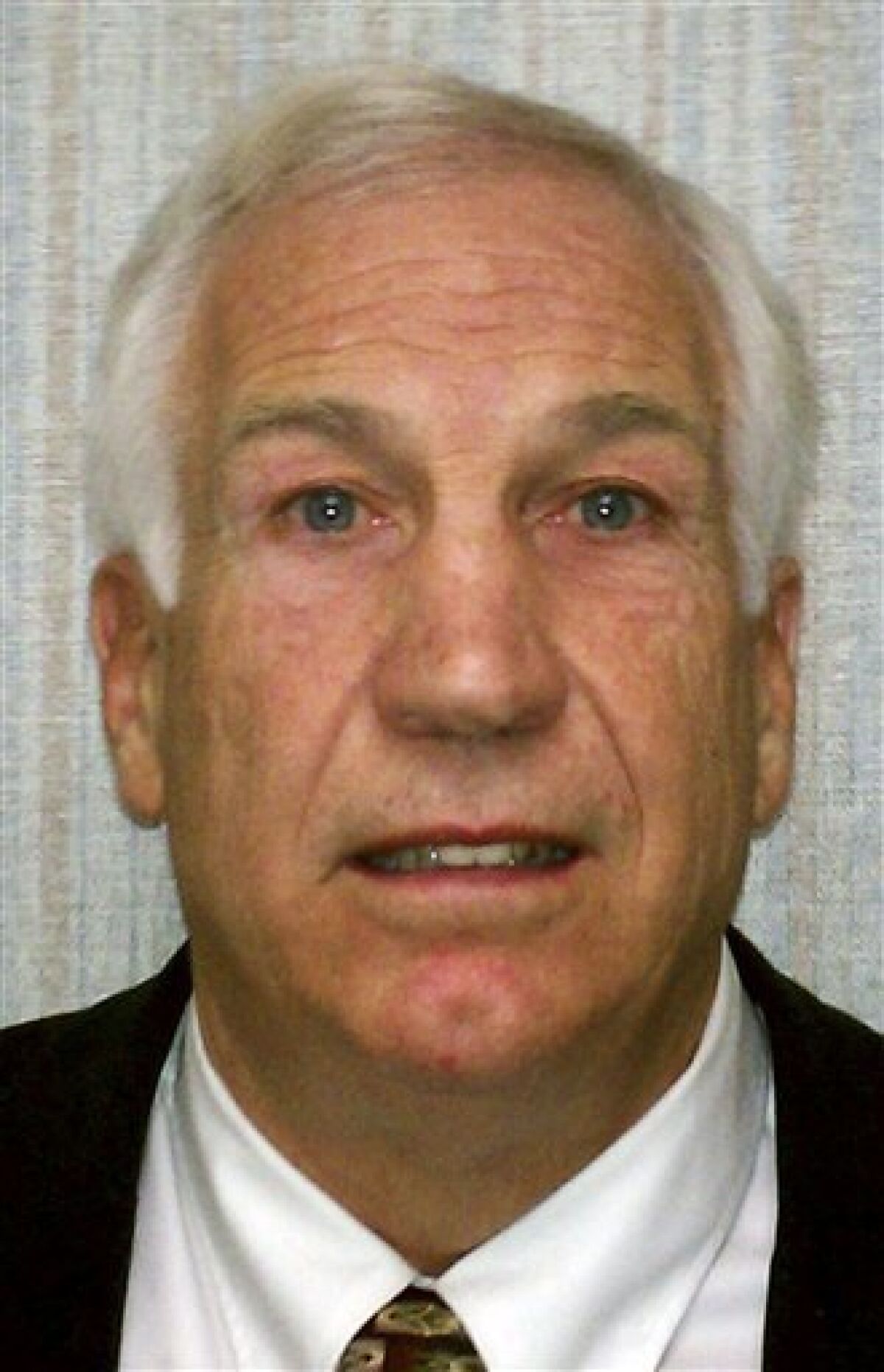 FILE - This Nov. 5, 2011 file photo provided by the Pennsylvania Office of Attorney General shows former Penn State football defensive coordinator Gerald "Jerry" Sandusky, who sexually abused a boy more than 100 times, then threatened his family to keep him quiet about the encounters, according to a lawsuit filed Wednesday, Nov. 30, 2011 that details new accusations not included in criminal charges against him. (AP Photo/Pennsylvania Office of Attorney General, File)