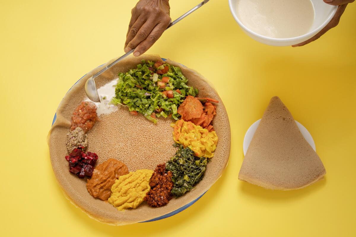 Vegetable combination on injera at Meals By Genet.