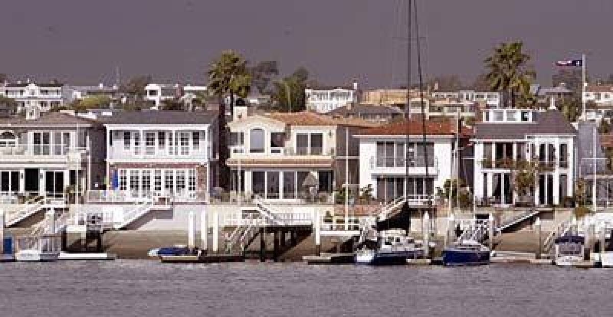 About 250 homes on Lido Isle in Newport Beach are on the water. All residents belong to the Lido Isle Yacht Club, the social hub of the community.