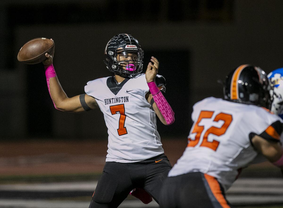 Huntington Beach's Daunte Bell throws a pass during a Sunset League game against Fountain Valley on Friday.