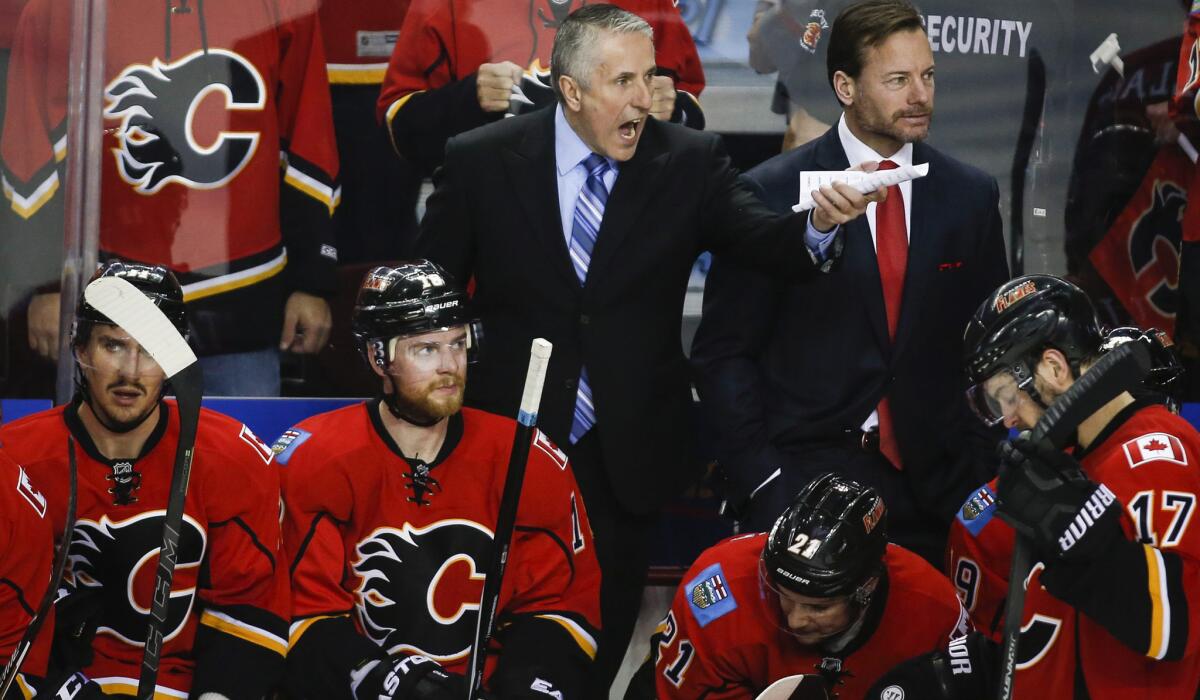 Flames Coach Bob Hartley questions a call during the third period of Game 4 on Friday night in Calgary.