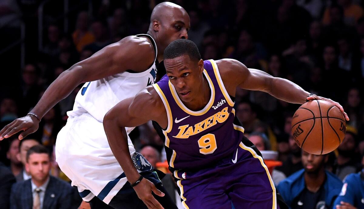 Lakers point guard Rajon Rondo drives around Timberwolves forward Anthony Tolliver during a game Nov. 7.