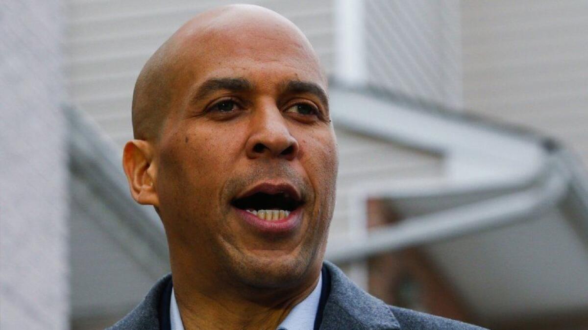 Sen. Cory Booker (D-N.J.) announces his presidential bid during a news conference Feb. 1 in Newark. His role in backing charter schools as that city's mayor has become an issue in his campaign.