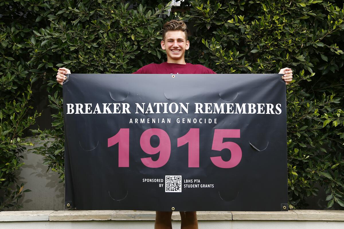 Ashton Azadian, a sophomore at Laguna Beach High School, raised awareness about the Armenian Genocide by bringing a banner. 