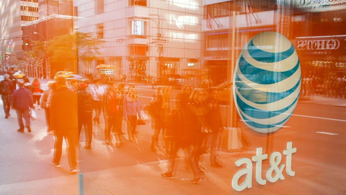 A federal judge will decide Tuesday whether to allow AT&T to buy Time Warner Inc., owner of CNN, HBO and Warner Bros.
