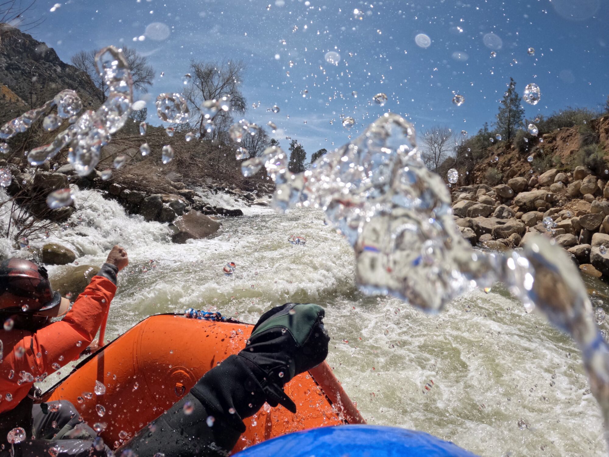 Rafters negotiate churning rapids during an early-season rafting tour on the Upper Kern River.