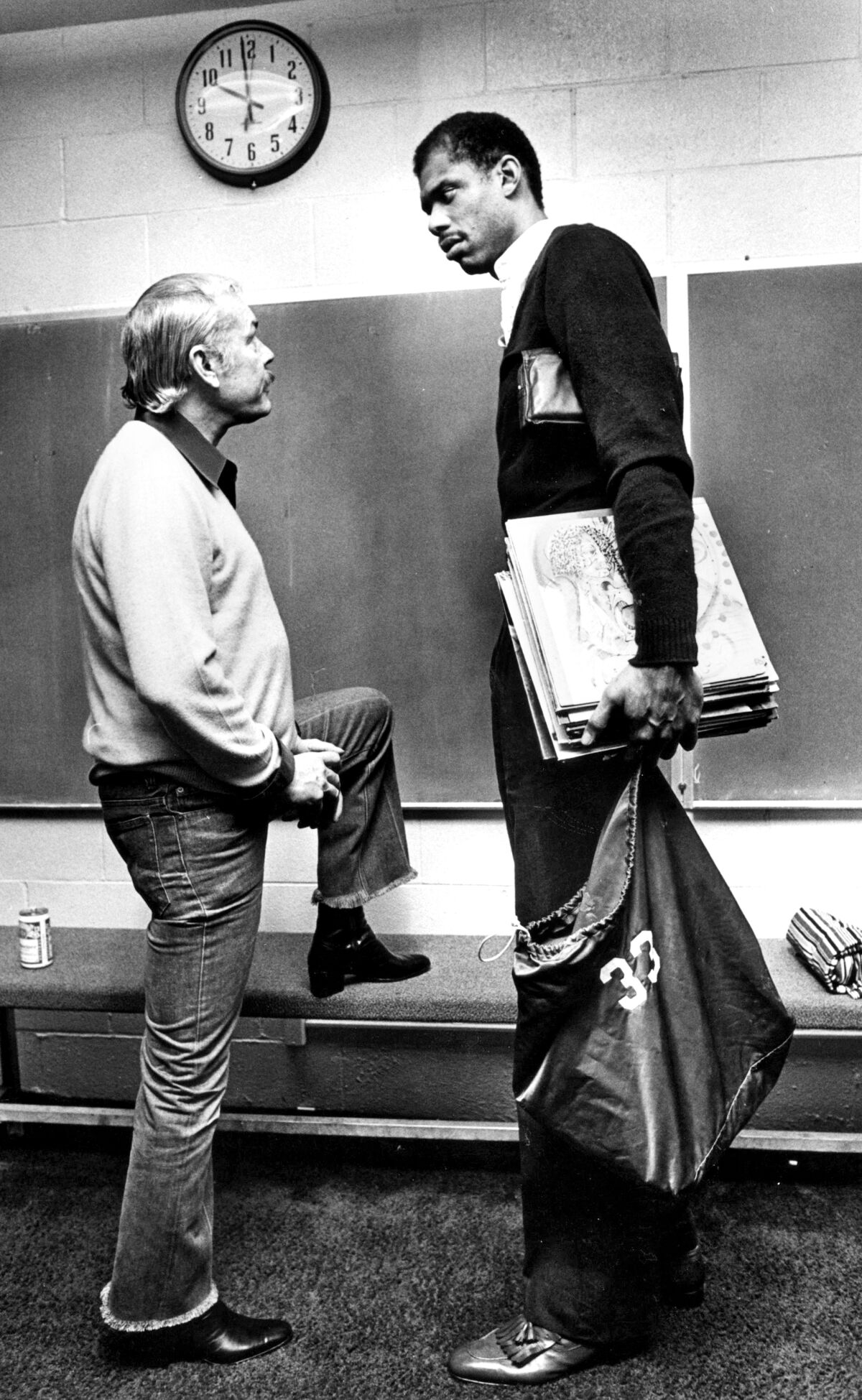 Feb. 14, 1983: Lakers owner Jerry Buss talks with Kareem Abdul-Jabbar in Lakers locker room following a game.