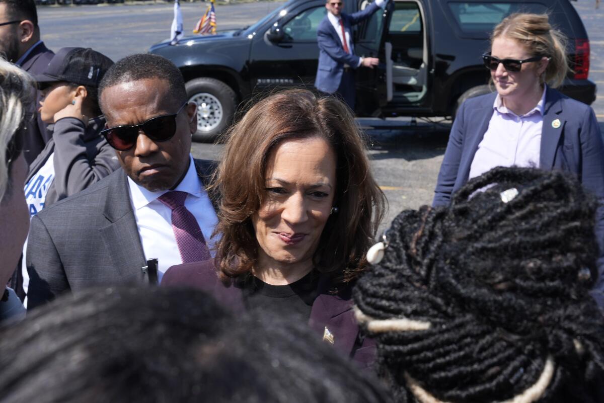 Democratic presidential nominee Vice President Kamala Harris greets supporters.