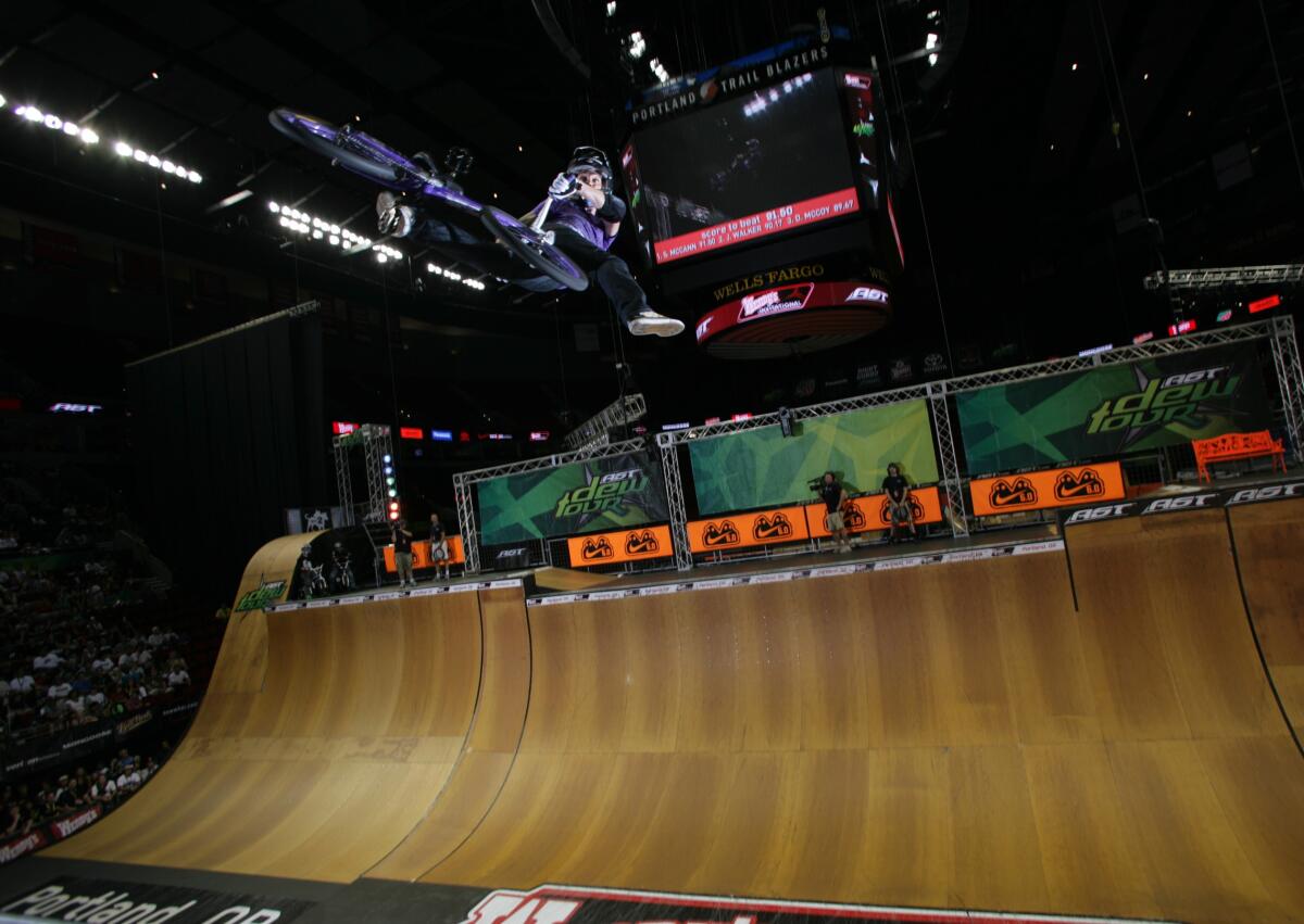 Eight-time BMX world champion Simon Tabron does a trick during a stop on the Dew Tour.