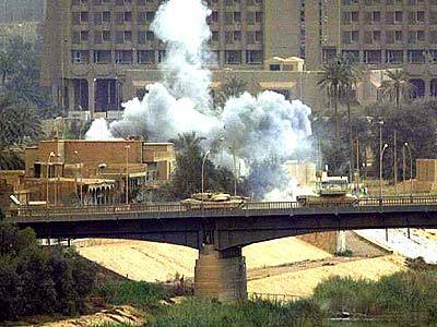 Tanks advance toward central Baghdad across one of the city's main bridges.