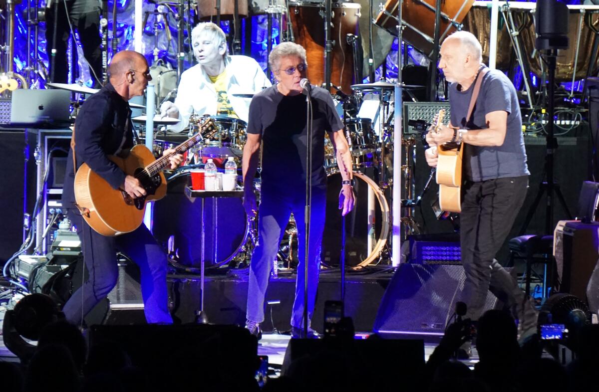 The Who's Simon Townshend (far left) and drummer Zak Starkey are shown at Saturday's Hollywood Bowl concert by the band with lead singer Roger Daltrey (center) and guitarist Pete Townshend.