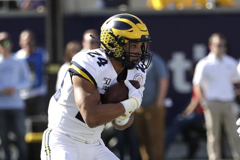 Michigan running back Zach Charbonnet runs against Alabama during the first half of the Citrus Bowl NCAA college football game, Wednesday, Jan. 1, 2020, in Orlando, Fla. (AP Photo/John Raoux)