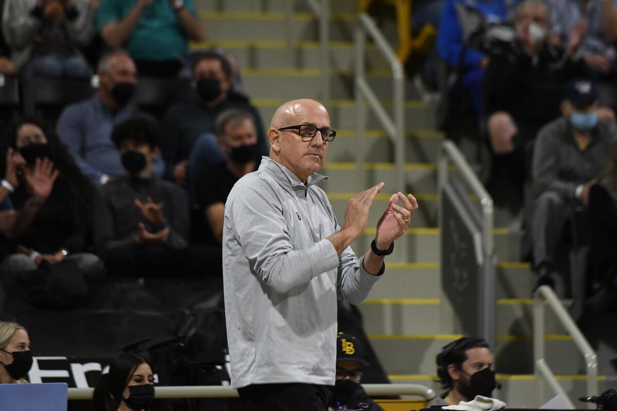 Long Beach State men's volleyball coach Alan Knipe claps during a match against UCLA.