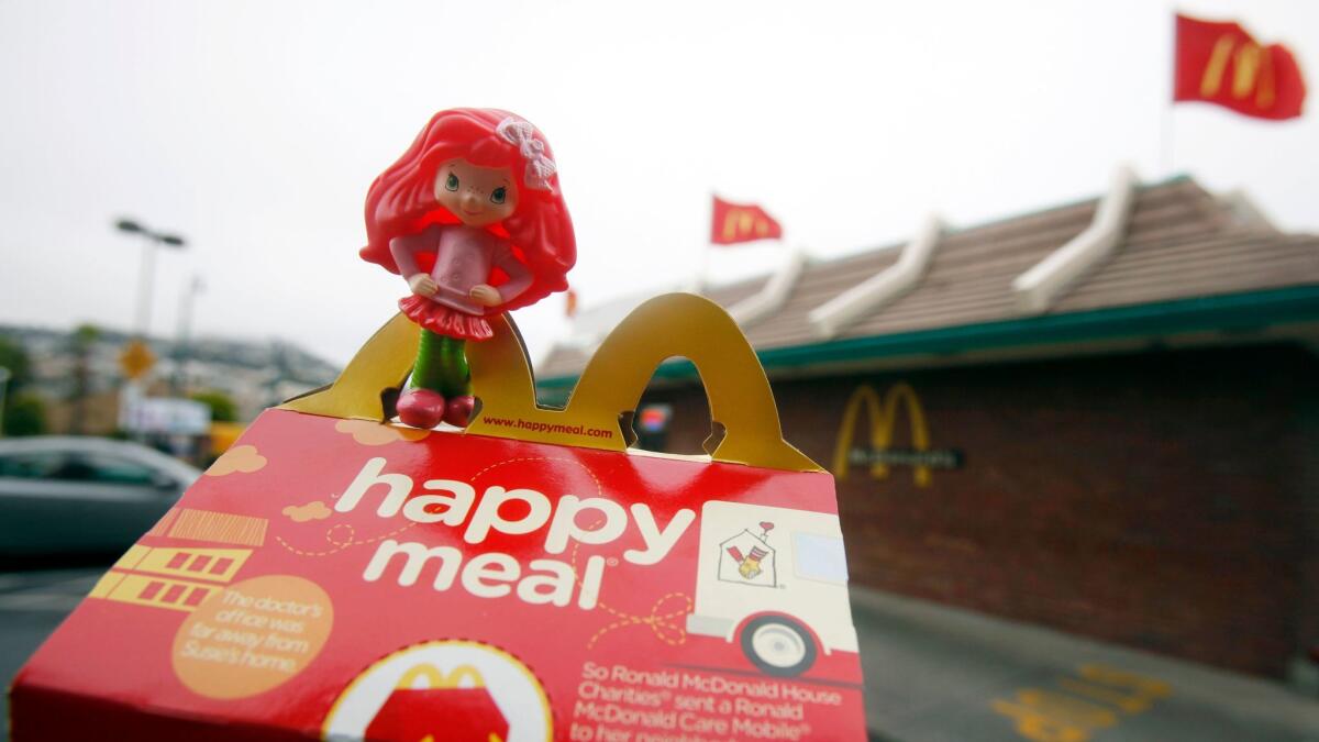 A Happy Meal box and toy are shown outside of a McDonald's restaurant in San Francisco on Oct. 1, 2010.